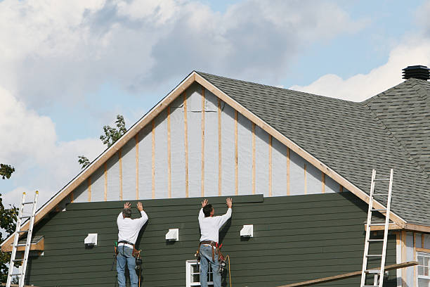 Professional Storm Damage Siding Repair technician working in Pineville, PA